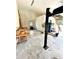 Spacious garage featuring an automotive lift and work bench at 5319 W Trapnell Rd, Dover, FL 33527
