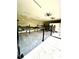 Garage interior featuring multiple automotive lifts, creating an efficient workshop space at 5319 W Trapnell Rd, Dover, FL 33527