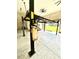 View of an automotive lift inside a large garage space at 5319 W Trapnell Rd, Dover, FL 33527