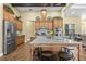 Modern kitchen featuring a granite island, stainless steel appliances, and custom cabinetry at 5319 W Trapnell Rd, Dover, FL 33527