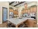 Well-equipped kitchen with stainless steel appliances, granite countertops, and large center island at 5319 W Trapnell Rd, Dover, FL 33527