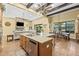 Gourmet kitchen with granite countertops, stainless steel appliances, and center island at 5319 W Trapnell Rd, Dover, FL 33527