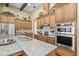 Well-equipped kitchen featuring granite countertops, stainless steel appliances, and abundant cabinetry at 5319 W Trapnell Rd, Dover, FL 33527
