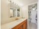 Well-lit bathroom featuring a vanity with ample counter space and a large mirror at 6020 S Shore Blvd # 709, Gulfport, FL 33707