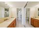 Spacious bathroom with double vanities, mirrors, and tile flooring at 6020 S Shore Blvd # 709, Gulfport, FL 33707