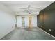 Spacious bedroom featuring a ceiling fan, sliding closet doors, and neutral color scheme at 6020 S Shore Blvd # 709, Gulfport, FL 33707