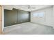 Bedroom with light carpet, ceiling fan, and a window providing natural light at 6020 S Shore Blvd # 709, Gulfport, FL 33707