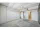 Bedroom with light carpet, ceiling fan, and access to closet and bathroom at 6020 S Shore Blvd # 709, Gulfport, FL 33707