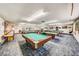 Spacious game room with multiple billiard tables and shuffleboard, offering ample space for residents to enjoy games at 6020 S Shore Blvd # 709, Gulfport, FL 33707