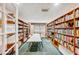 Inviting library with floor-to-ceiling bookshelves filled with books, creating a cozy and intellectual atmosphere at 6020 S Shore Blvd # 709, Gulfport, FL 33707