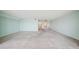 Open living room with light carpet and access to other rooms in the home at 6020 S Shore Blvd # 709, Gulfport, FL 33707