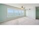 Bright living room with carpet and large windows offering a wonderful view at 6020 S Shore Blvd # 709, Gulfport, FL 33707