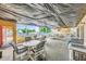 Relaxing outdoor patio area with poolside views, featuring comfortable seating and shade for enjoying the outdoors at 6020 S Shore Blvd # 709, Gulfport, FL 33707