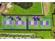 Overhead shot of two pickleball courts with shading structures, situated in a lush, landscaped area of the community at 6020 S Shore Blvd # 709, Gulfport, FL 33707