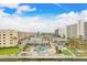 Community offers pool area and lounging area with chairs and umbrellas, and parking, all surrounded by green landscaping at 6020 S Shore Blvd # 709, Gulfport, FL 33707