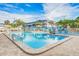 Bright swimming pool features clear water, lounge chairs, and a sunny sky, creating an inviting outdoor space at 6020 S Shore Blvd # 709, Gulfport, FL 33707