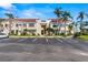 Exterior shot of building featuring stairs leading to units, complemented by nearby parking at 6131 Bahia Del Mar Blvd # 241, St Petersburg, FL 33715