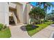 Exterior shot of building featuring stairs leading to units, complemented by manicured landscaping at 6131 Bahia Del Mar Blvd # 241, St Petersburg, FL 33715