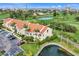 Exterior angle showcasing the property's well-kept landscaping, parking and views of the nearby golf course at 6131 Bahia Del Mar Blvd # 241, St Petersburg, FL 33715