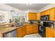 Open kitchen with stainless steel dishwasher and view to the living room at 6131 Bahia Del Mar Blvd # 241, St Petersburg, FL 33715
