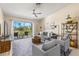 Comfortable living room with modern decor, plush seating, and a sliding glass door to balcony with golf course views at 6131 Bahia Del Mar Blvd # 241, St Petersburg, FL 33715