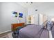 Comfortable bedroom with modern decor, featuring a gray color scheme and wood-look flooring at 6131 Bahia Del Mar Blvd # 241, St Petersburg, FL 33715