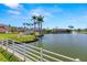 Scenic view of a waterfront community with a beautiful lake, fountain, and well-maintained landscaping at 6131 Bahia Del Mar Blvd # 241, St Petersburg, FL 33715