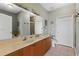 Large bathroom with double vanity, walk-in shower, separate toilet area and plentiful cabinet space at 6319 Sunset Bay Cir, Apollo Beach, FL 33572