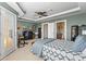 Spacious bedroom with ceiling fan, desk and exterior access boasts natural light and is great for work at 6319 Sunset Bay Cir, Apollo Beach, FL 33572