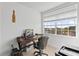 Bright bedroom with a desk, office chair and view from a large window at 6319 Sunset Bay Cir, Apollo Beach, FL 33572