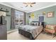 Comfortable bedroom with natural light, neutral colors, and a cozy atmosphere at 6319 Sunset Bay Cir, Apollo Beach, FL 33572