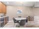 Dining area featuring wood floors, a marble top table, and a wine bar at 6319 Sunset Bay Cir, Apollo Beach, FL 33572