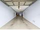 Large garage space with epoxy flooring and potential for storage or workspace at 6319 Sunset Bay Cir, Apollo Beach, FL 33572