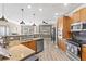 Spacious kitchen featuring a granite countertops and stainless steel appliances at 6319 Sunset Bay Cir, Apollo Beach, FL 33572
