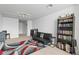 Cozy bonus room featuring modern decor and a black futon for relaxing at 6319 Sunset Bay Cir, Apollo Beach, FL 33572