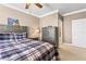 Comfortable main bedroom with bedside lamp, dresser, and access to the ensuite bathroom at 6319 Sunset Bay Cir, Apollo Beach, FL 33572