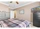 Comfortable main bedroom with ceiling fan and adjacent bathroom at 6319 Sunset Bay Cir, Apollo Beach, FL 33572