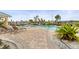 Community pool featuring a variety of seating options and tropical greenery at 6319 Sunset Bay Cir, Apollo Beach, FL 33572