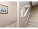 Carpeted staircase with white trim leads to the upper levels, enhanced by neutral wall colors and a portrait at 6319 Sunset Bay Cir, Apollo Beach, FL 33572
