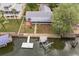 Aerial shot of home with fenced yard, boat dock, lift and screened porch with waterfront access at 6914 Harbor Dr, Hudson, FL 34667