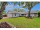 Single story home with an established lawn, rock bordered flower beds and a two-car garage at 6914 Harbor Dr, Hudson, FL 34667