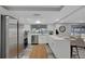 Modern kitchen with stainless steel appliances, white cabinetry, and an open design at 6914 Harbor Dr, Hudson, FL 34667