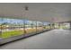 Enclosed lanai with water views, offering a seamless indoor-outdoor living experience and plenty of natural light at 6914 Harbor Dr, Hudson, FL 34667