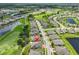 High aerial view of a golf course community showing the lakes, golf course, and landscaping at 724 Chipper Dr, Sun City Center, FL 33573