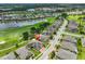 Beautiful aerial view of a neighborhood on a golf course with a lake and lush landscaping in this community at 724 Chipper Dr, Sun City Center, FL 33573