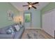 Bedroom offering a sitting area, plush couch, and a bright window with a lovely view at 724 Chipper Dr, Sun City Center, FL 33573