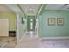 Entryway showing a long hallway with archways and bright natural light from the front door at 724 Chipper Dr, Sun City Center, FL 33573
