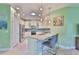 Kitchen features a breakfast bar, stainless appliances, and ample cabinet space at 724 Chipper Dr, Sun City Center, FL 33573