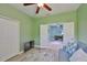 Bright living room with ceiling fan, open doorway, and closet offers a comfortable and inviting space at 724 Chipper Dr, Sun City Center, FL 33573