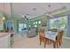 The living space features an open floor plan to the dining area and an outdoor patio at 724 Chipper Dr, Sun City Center, FL 33573